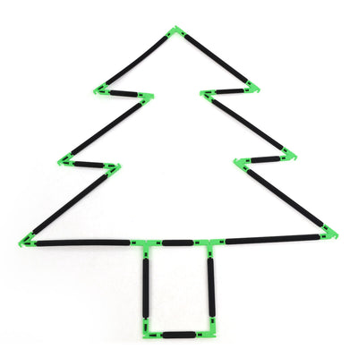 A flat 2D Christmas tree outline built with Inventix, showing three tiered triangular layers that step inward from bottom to top with a small rectangular trunk at the base, made from black rods and green angle connectors laid flat on a surface.