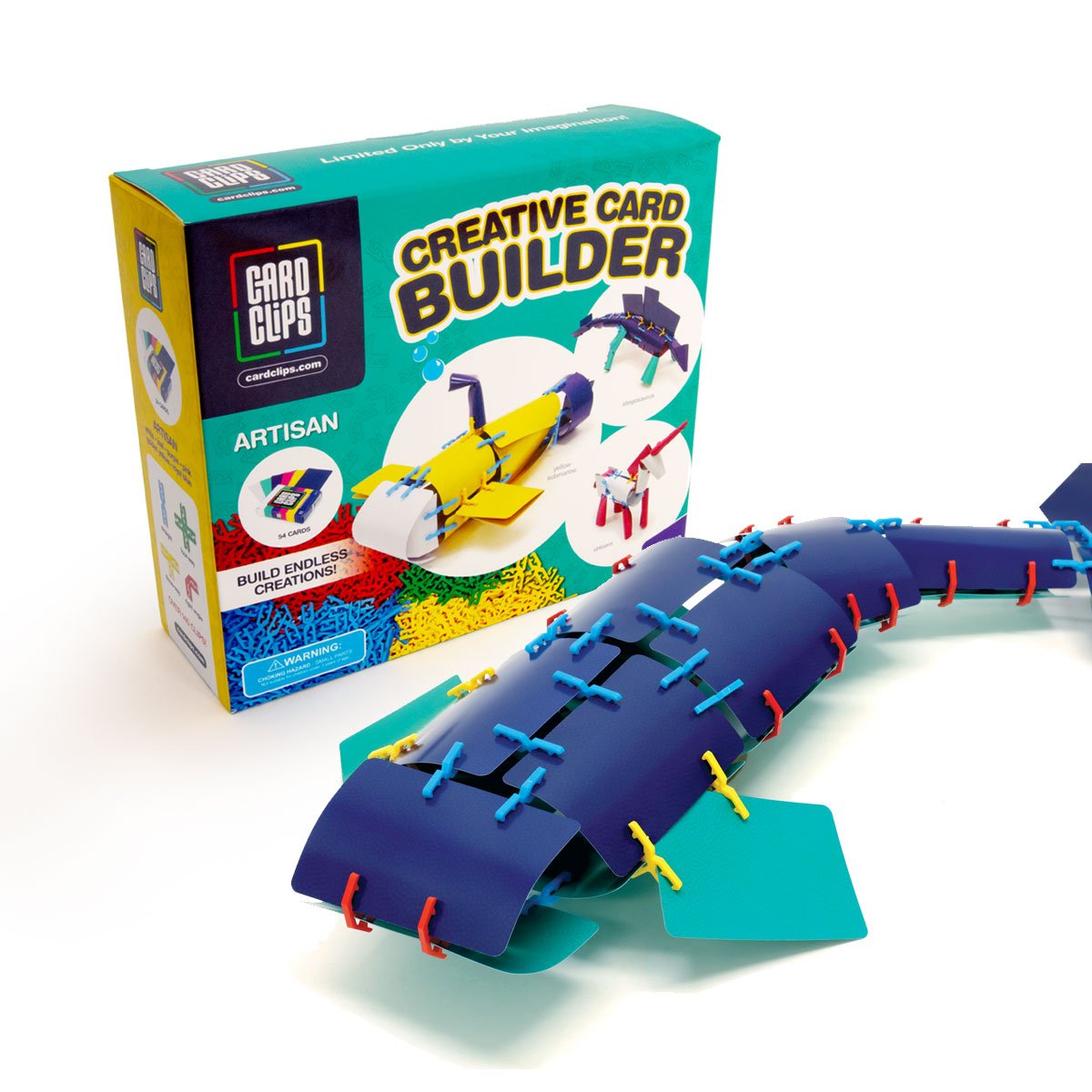 Creative Card Builder Artisan set from Atwood Toys, the retail box beside a finished navy-blue whale built from cards joined with red, blue, and yellow Card Clips connectors.