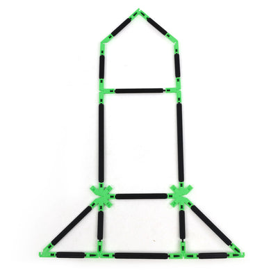 A flat 2D rocket outline built with Inventix, showing a pointed nose cone at the top, a rectangular body with horizontal crossbars, two green star connectors at the midsection, and a wide triangular base forming the fins and booster section.