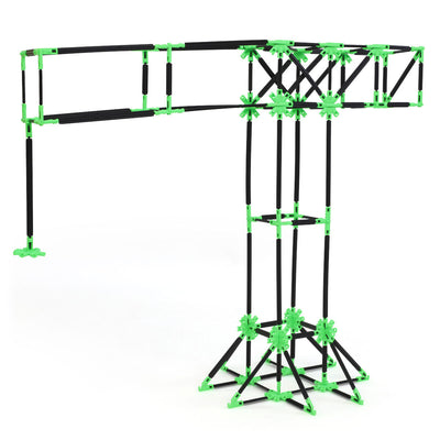 A construction crane built with Inventix, featuring a tall vertical tower with a long horizontal boom arm extending to one side, a counterweight section, and a wide triangulated base for stability.