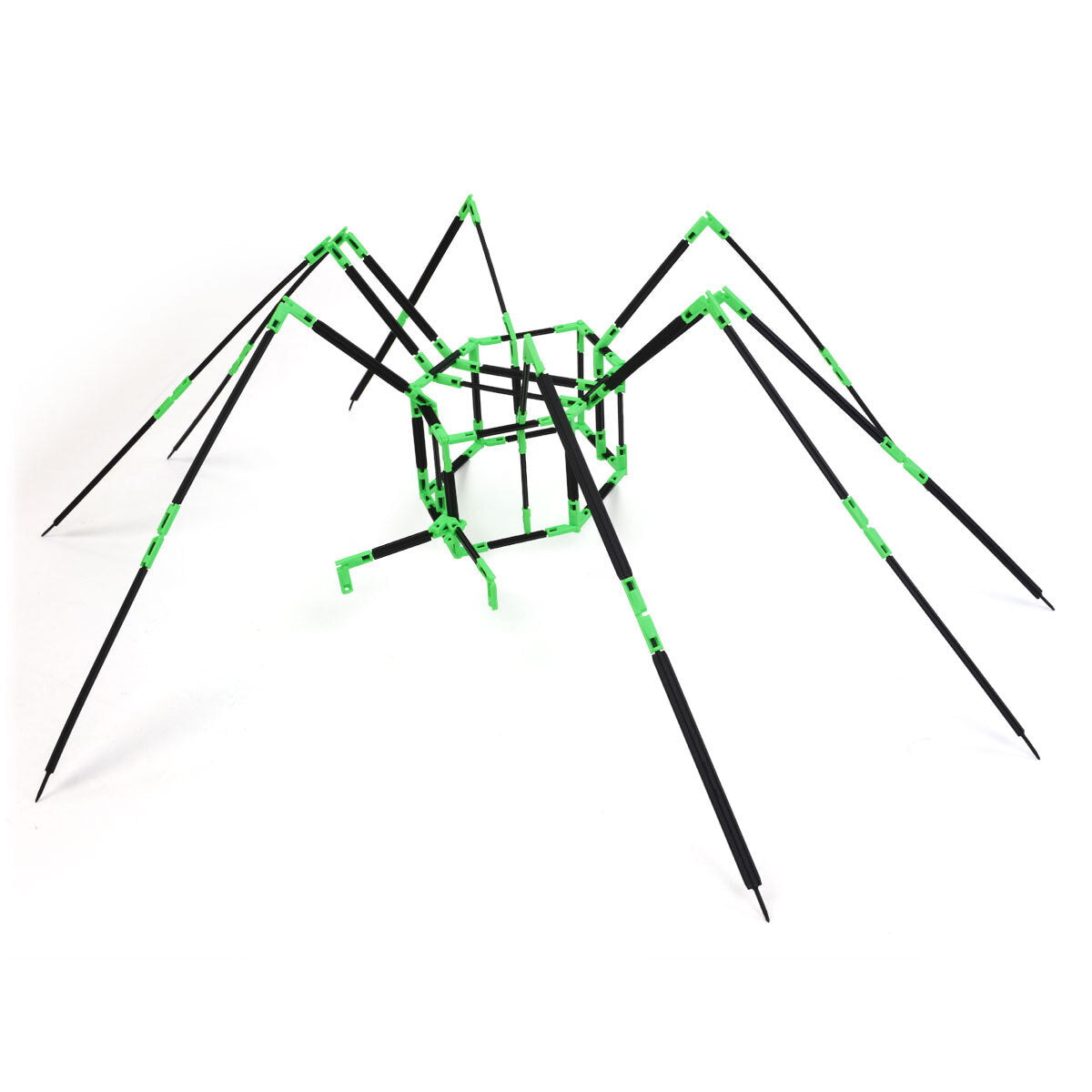 A spider build made with Inventix, featuring a compact rectangular body made from green connectors and black rods with eight long, angled legs extending outward in all directions.