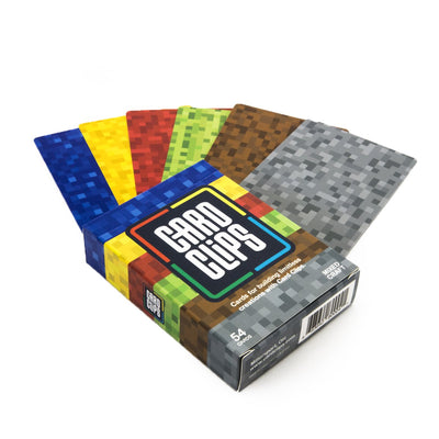 Pixel Bitcraft Building Cards from Atwood Toys, a fanned 54-card deck printed with pixel-style blue, yellow, red, green, brown, and gray block textures for building creations with Card Clips.